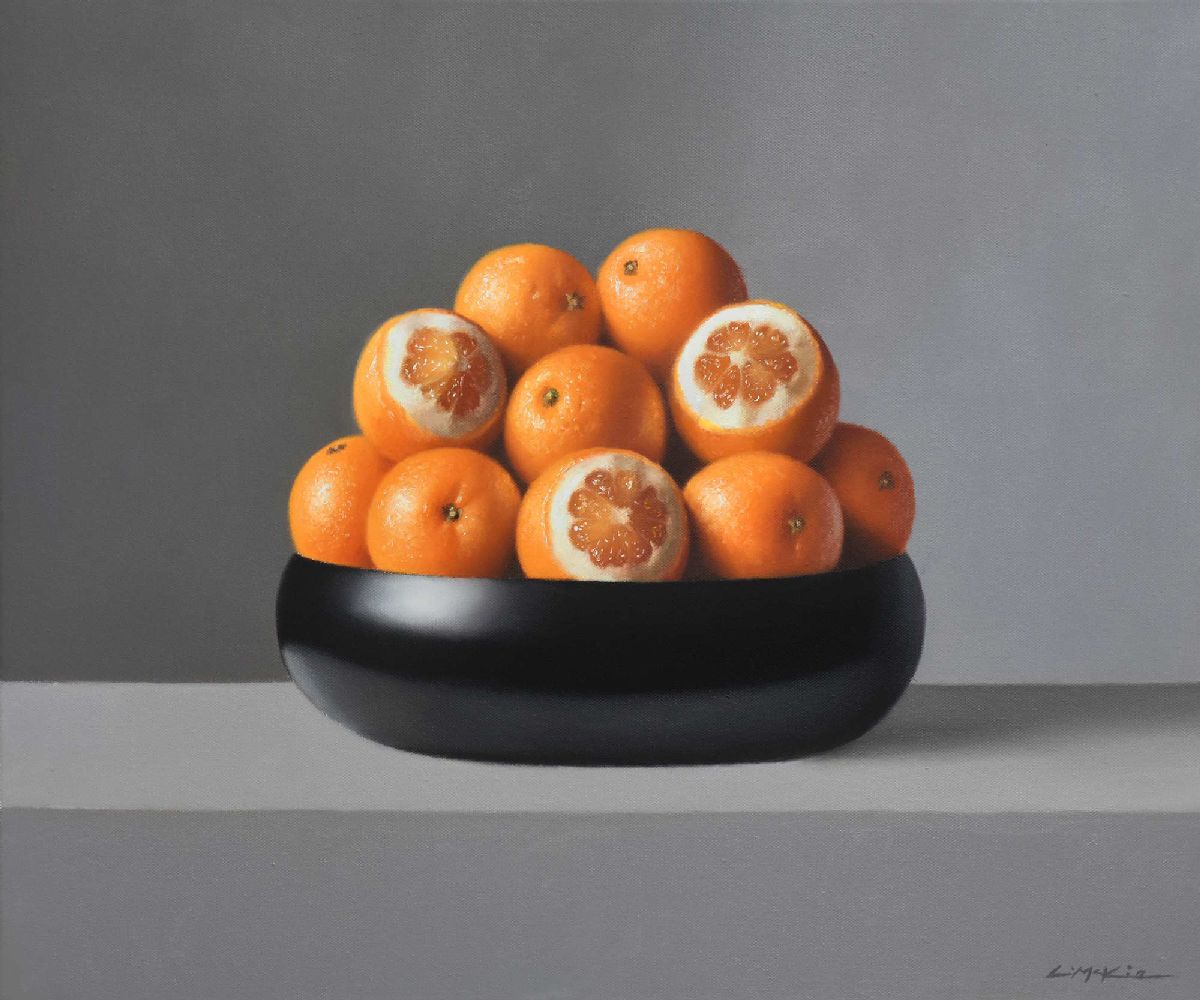 Oranges in Black Bowl